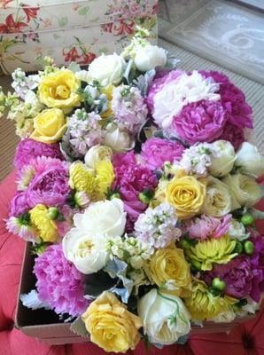 A box of centerpieces and bouquets from Florist at Windward