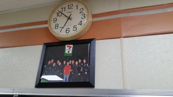 Torrance Police Officers with a 7-Eleven employee outside the store.