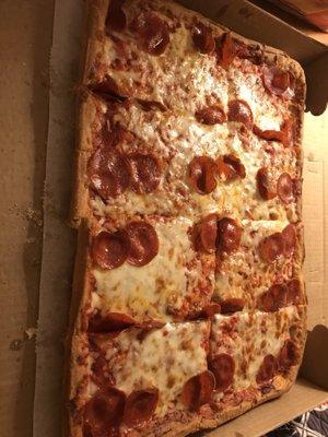 Sicilian pizza with cheese and pepperoni