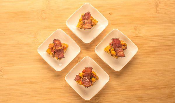 Fried Polenta topped with Corn Salad and Crispy Bacon