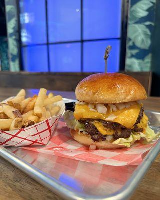 Classic Smashy: Two Smashed brisket patties, shredded lettuce, tomato, pickles, mustard, and diced onions.