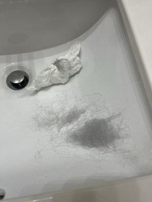 Sink with my fried hair after the fiasco by another stylist at a different salon.