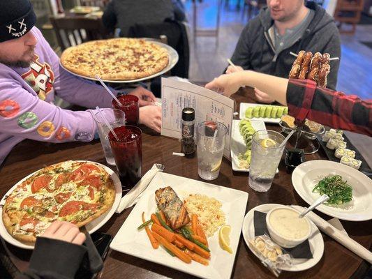 Margarita pizza , grilled salmon , New England clam chowder, sushi salad