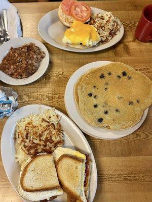 Wazoo w hash browns, Maiden Lane w hash browns ($9.25), short stack of blueberry pancakes ($6.35), Side of Apple Sauce ($1.39)