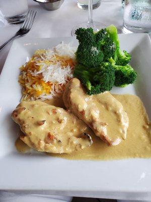 Dijon chicken breast, steamed broccoli and two colors of very nice basmati (?) rice.