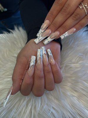 Long Acrylic Nails with Marble and Chain Designs