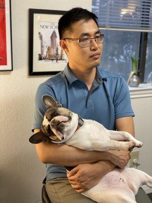 Dr. Andy Tseng, Physical Therapist and Stella during a team meeting