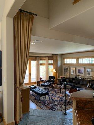 We made all the side hangs and drapes in this room. There are also sheers over woven wood shades by the doors.