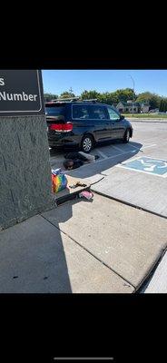 Typical vagrant sleeping in the parking lot