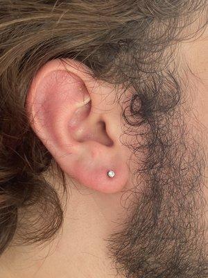 Lobe piercing by Julie