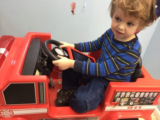 Before, checking out the fire truck and cartoons