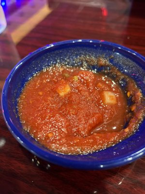 Salsa served with chips at the table. Very tasty not to spicy.