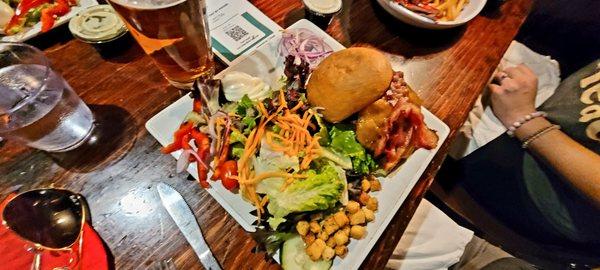 Lumberjack burger with a side salad.