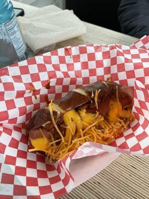 Chili cheese dog with pretzel bun