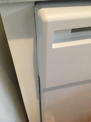 Dishwasher door catches on cabinetry and will not close, causing leaks.