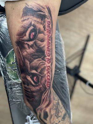 Determined to succeed lion eyes tattoo done by Drew @9414ink