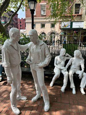 Park sculptures of two women and two women conversing