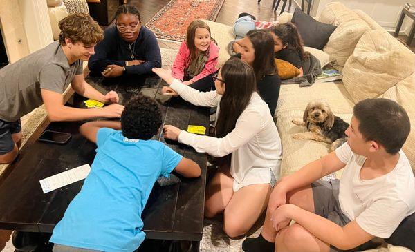 Students playing board games at the boarding home.