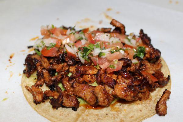 Al Pastor Taco ( Soft Corn Tortilla + Marinated Pork + Pico de Gallo + Guacamole.