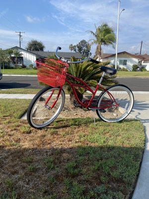 Red beach cruiser with add on red basket.