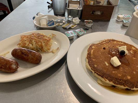 Blueberry pancake, hash browns and sausage links