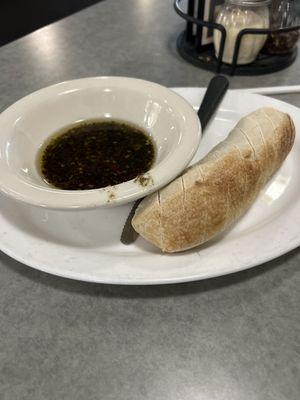 Complimentary bread with dipping sauce.