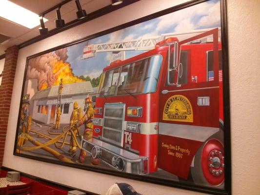 huge fire truck mural on the wall