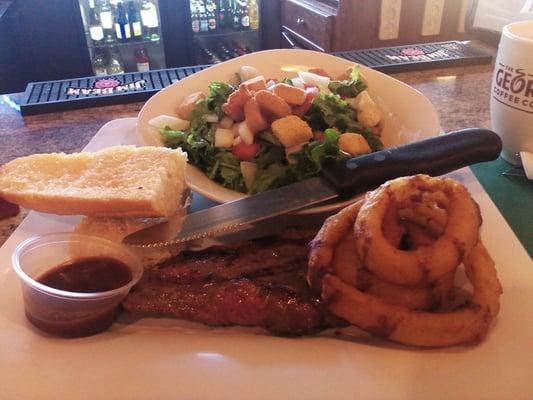 Strip steak and salad.