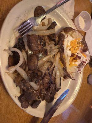 Smothered 14 oz ribeye with loaded baked potato