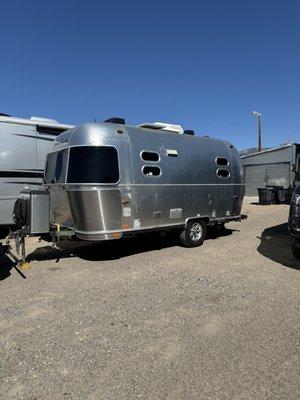 Camper has a lift kit and rugged tires.