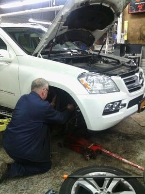 Oscar Senior Technician working on MB GL 450 Air Suspension  the worked costed approximately half the price than quoted at the dealership