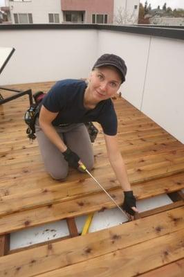 Making sure the roof under this lovely new construction roof deck slopes toward its drains.  Spoiler: It did.