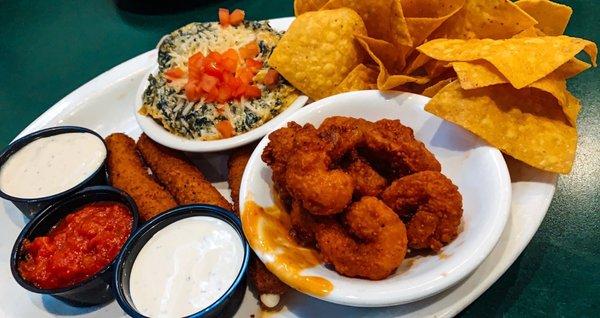 App sampler. Buffalo shrimp, artichoke dip and mozzarella sticks. Yummy!!