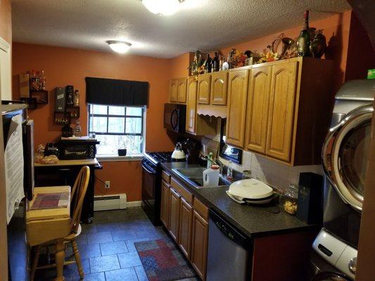 Installed new cabinets, laminate counter top, tile, paint, new appliances, and washer and dryer hookups