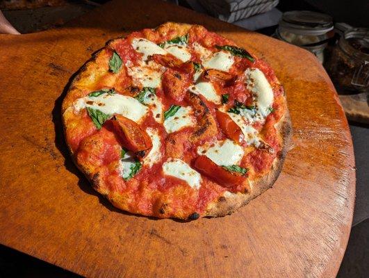 Margherita pizza fresh from the wood oven