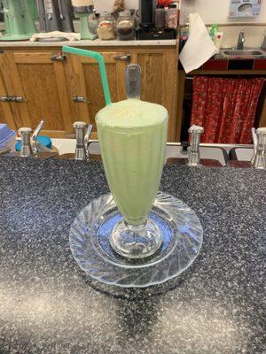 Green apple soda float (green apple flavoring, vanilla ice cream, seltzer water)