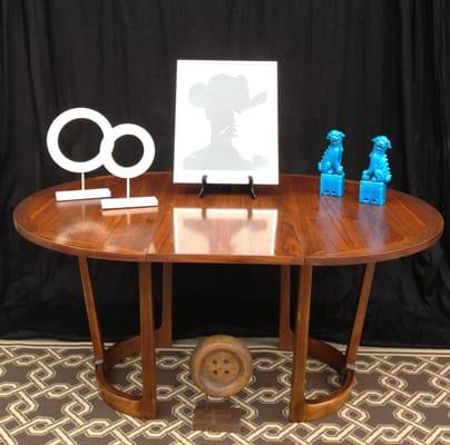 Fabulous vintage Lane dining table with turquoise foo dogs and Marlboro Man framed art