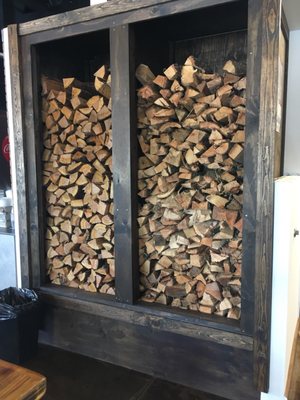 Impressive stack of wood greets you into the dining room