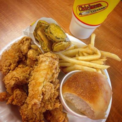 Chicken strip combo with gravy, fried pickles, fries, and a roll. #sogood #yum #chickenexpress