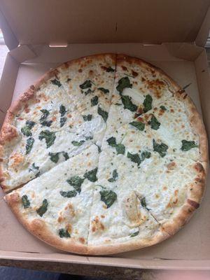 White pizza with chicken and spinach