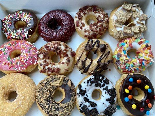 $18 for a dozen mixed donuts (4 classic, 4 specialty, 4 ultimate) Fresh & Soft. Very sweet, but delicious!