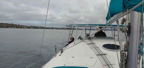 Captain Curtis at the helm, approaching Point Loma.