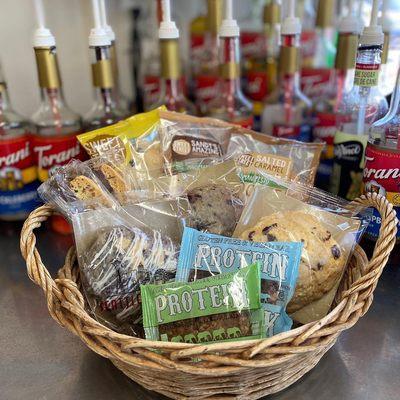 Some of our yummy food options! Pictured are scones, protein pucks, biscotti, and cookies. We also carry muffins and bagels