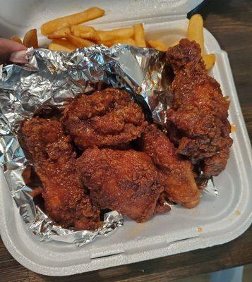 Honey hot wings and fries.