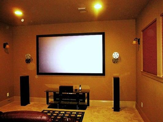 110" black diamond screen with 5.1 Definitive Technologies speakers, equipment in closet