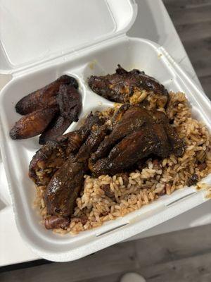 Jerk chicken  Rice and peas and fried plantains