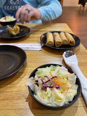 Salad and egg rolls