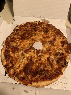 Extra thin, well done cheese and sausage pizza.