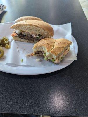 Torta de asada muy sabrosa. Well made torta seasoned just right pepper and a sauce that is truly a pleasure for the taste buds.