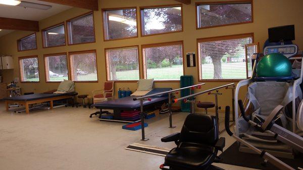 Large windows add natural light and interest for patients having physician and occupational therapy in our gym.